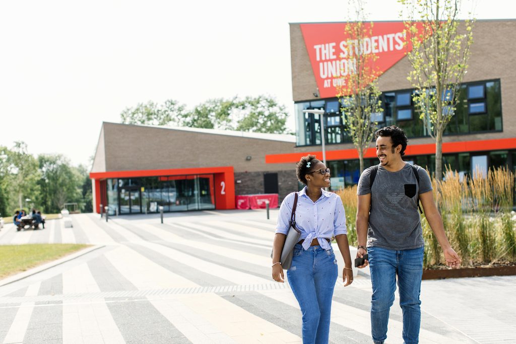 Two students walking in front of the Students Union Building