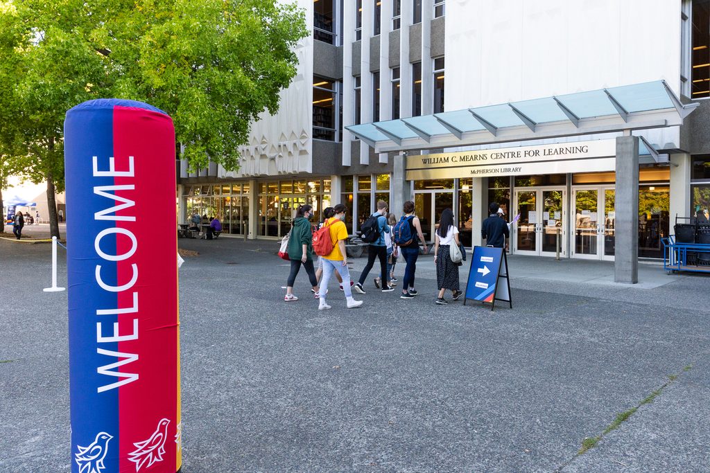 Students entering the library for the orientation
